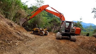 Abandoned digger and Vintage Bristol Bulldozer widening corners on a steep track [upl. by Jillian56]